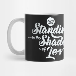 Standing in the Shadows of Lev radio show tee (lt grey logo) Mug